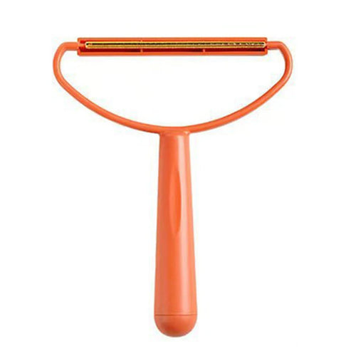 Nuzzle Fur Remover orange handheld tool with copper blade